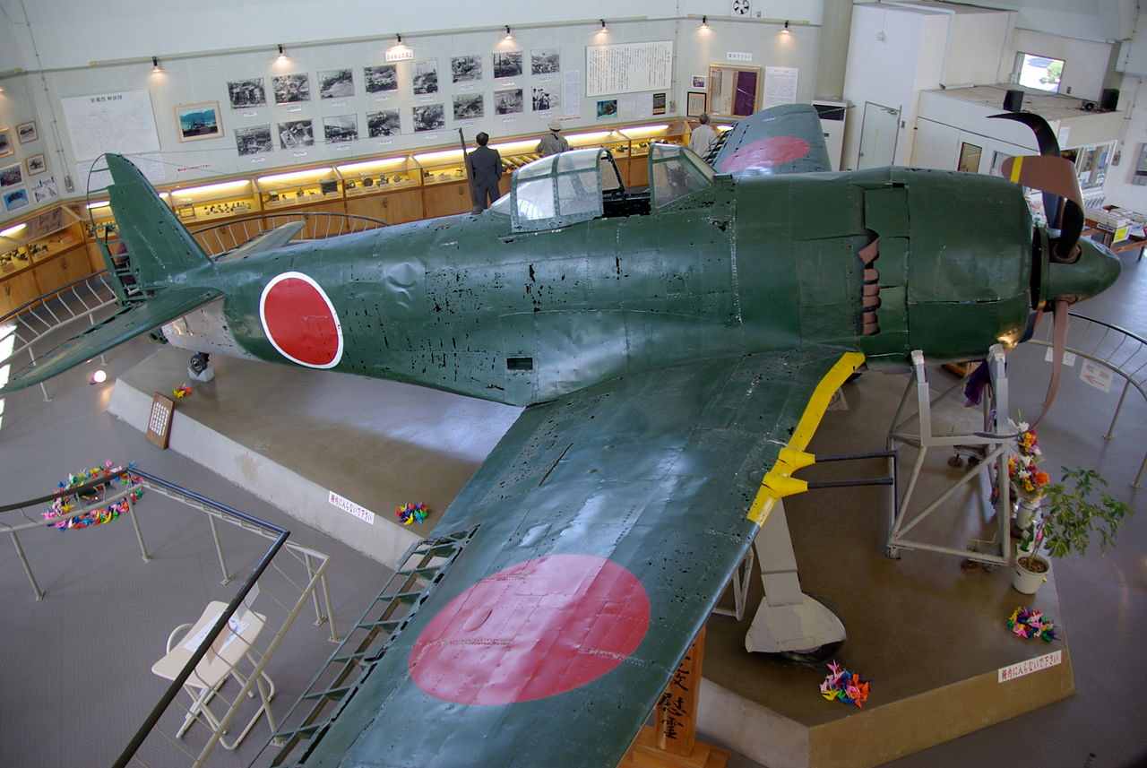 这架隶属于第343海军航空队的紫电改（N1K2-J）战斗机于1978年11月18日在城园久良湾（Jyoen Hisayoshi Bay）被发现。该机有可能是前日本海军王牌飞行员武藤金义（Kaneyoshi Muto）的座机，目前存放在日本爱媛县南乐库御庄公园（Nanreku Misho Koen）内展出。